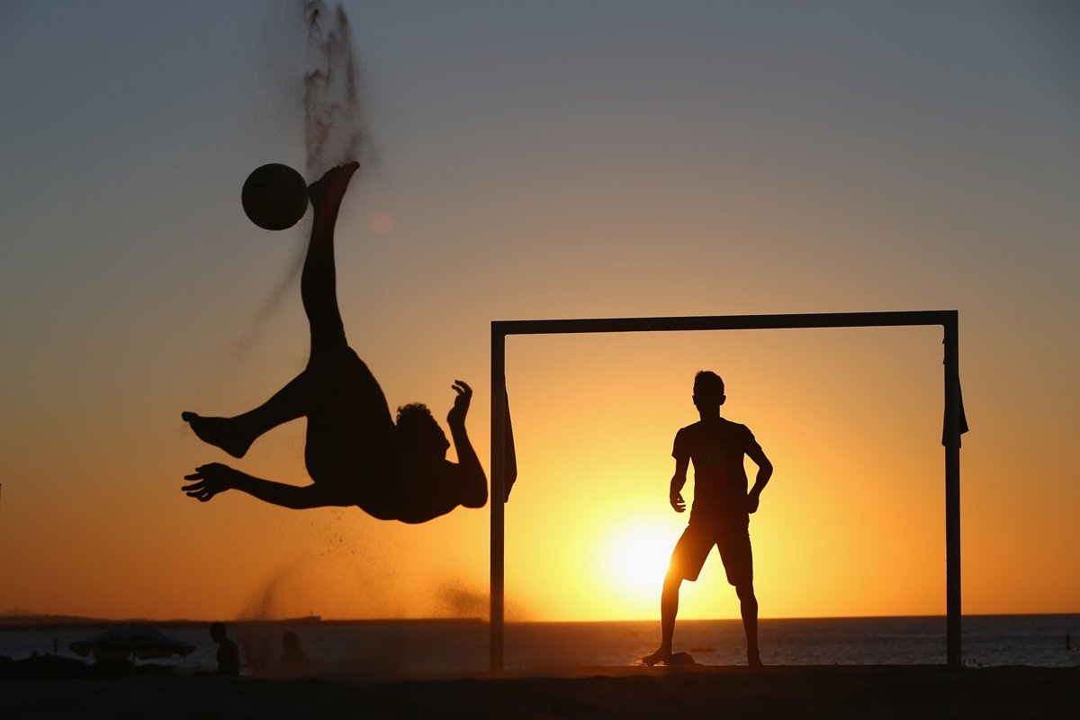 locals-play-soccer-at-sunset-on-a-beach-in-fortaleza-brazil.