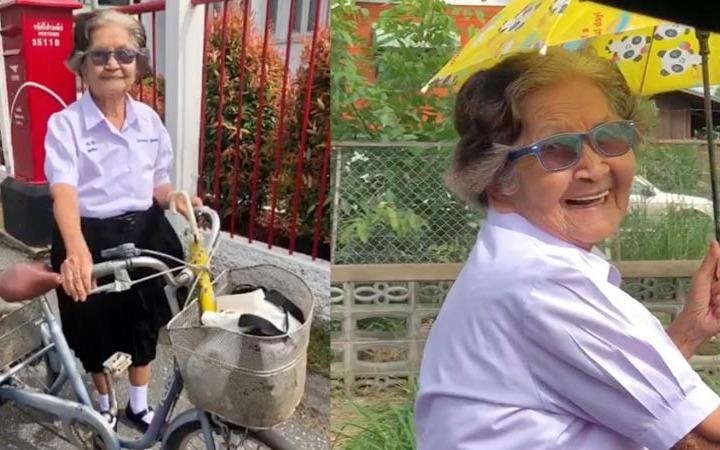 Cu ba 84 tuoi mac dong phuc, dap xe ve nha sau ky thi het lop 6 hinh anh