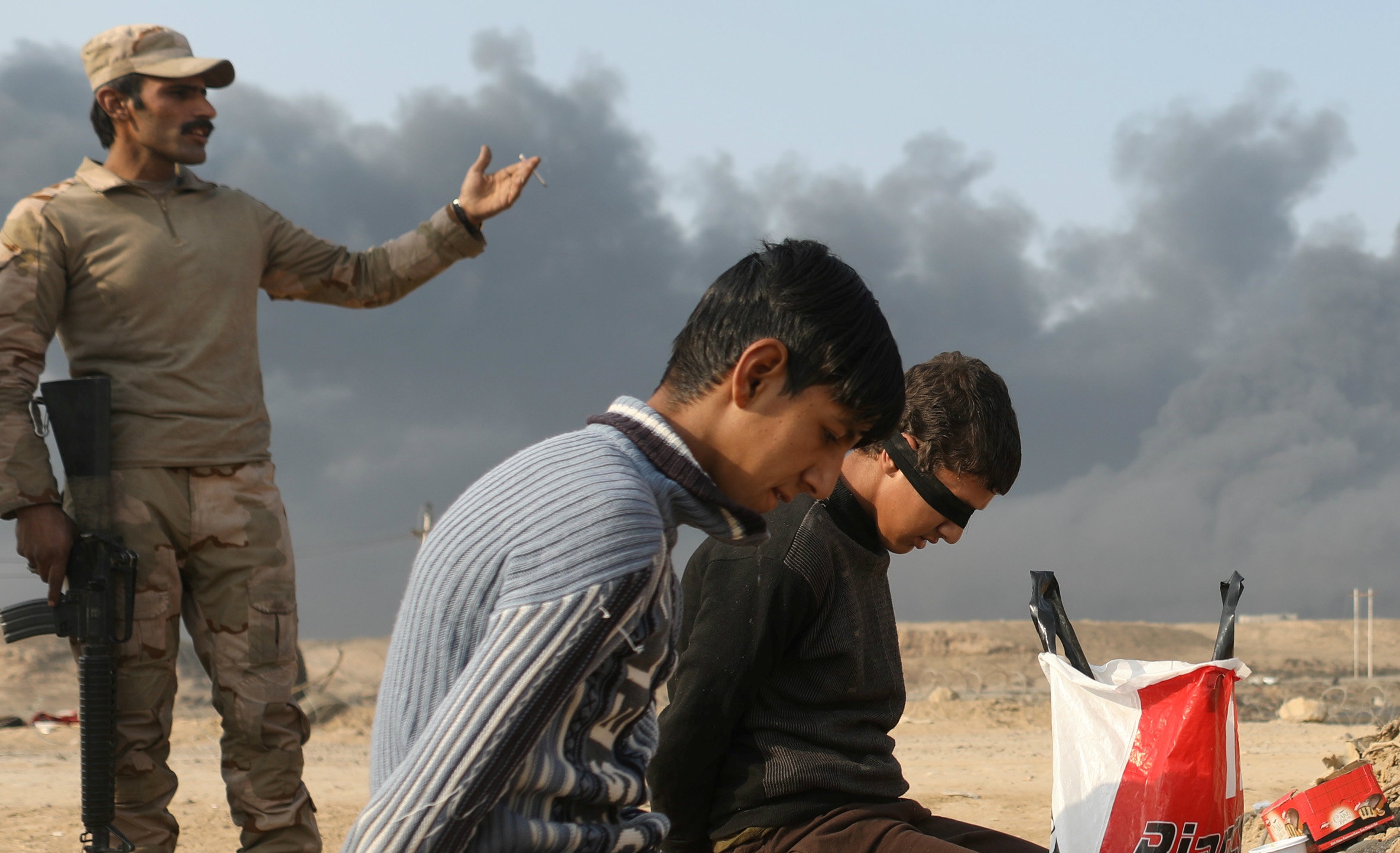 Phien quan IS o Iraq dong loat cao rau de chay tron hinh anh