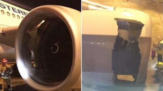 May bay Trung Quoc ha canh khan cap vi lo thung o vo dong co hinh anh