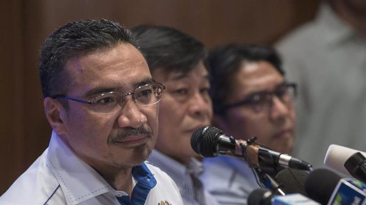 Malaysia dieu tra Cuc Nhap cu vi hai ho chieu gia hinh anh