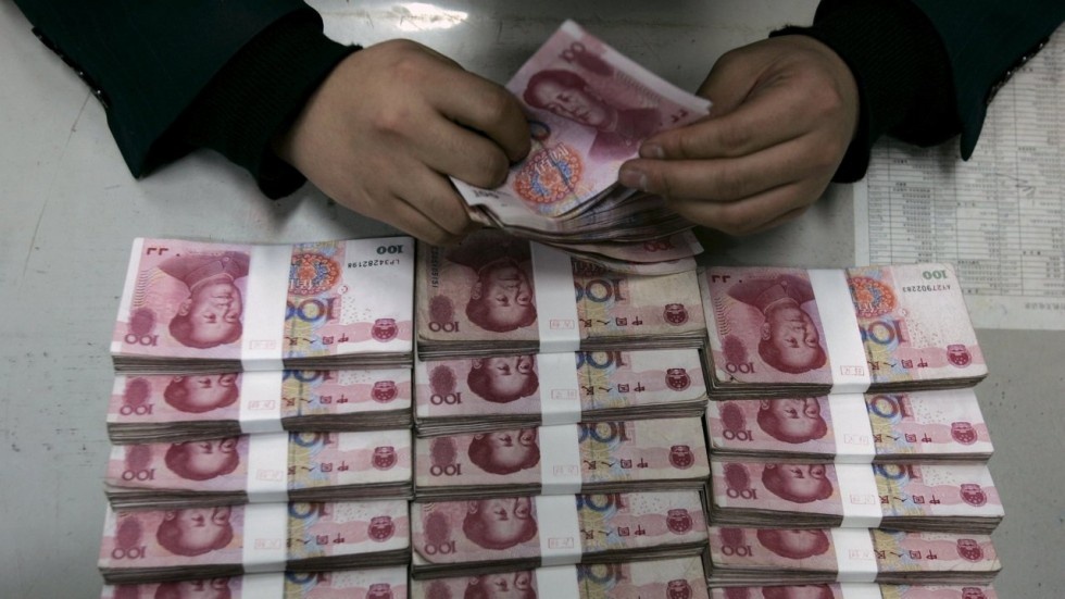 Trung Quoc pha dong chuyen tien trai phep hon 125 ty USD hinh anh