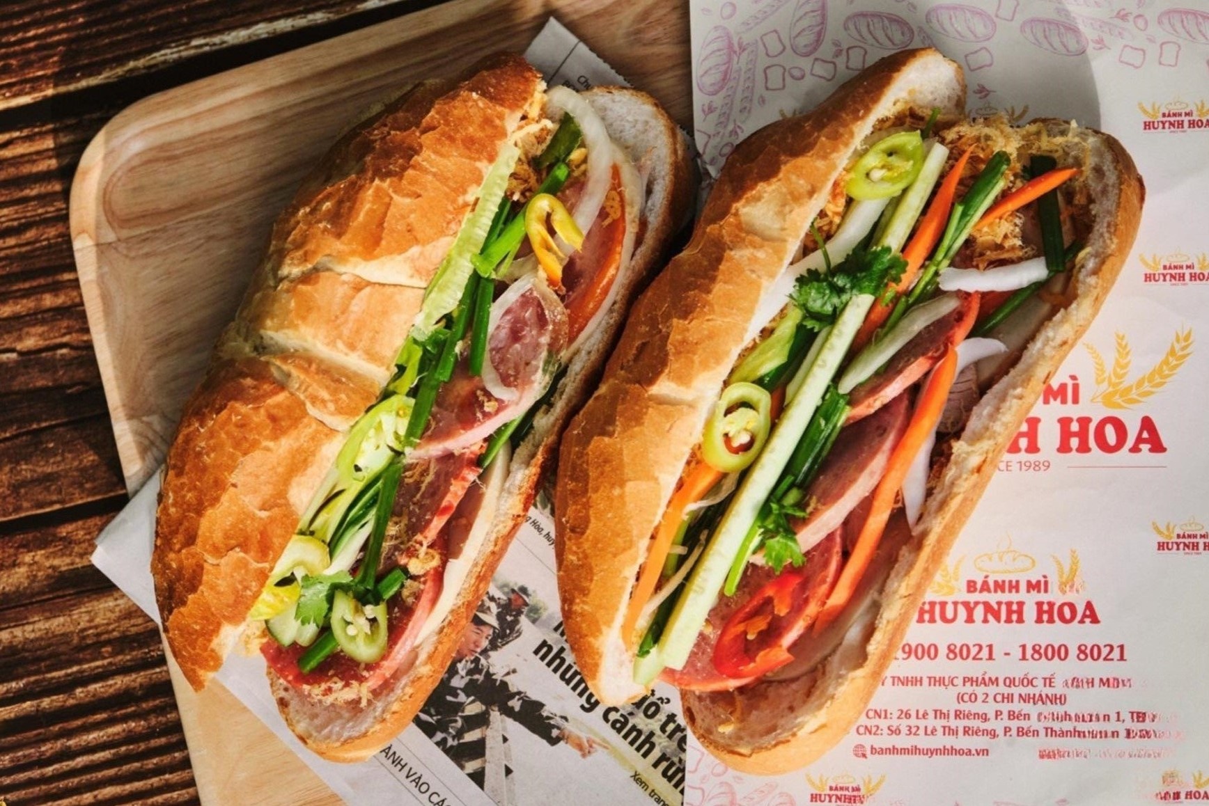Tranh cai khau phan 'khong lo' tai banh mi Huynh Hoa, com tam Ba Ghien hinh anh