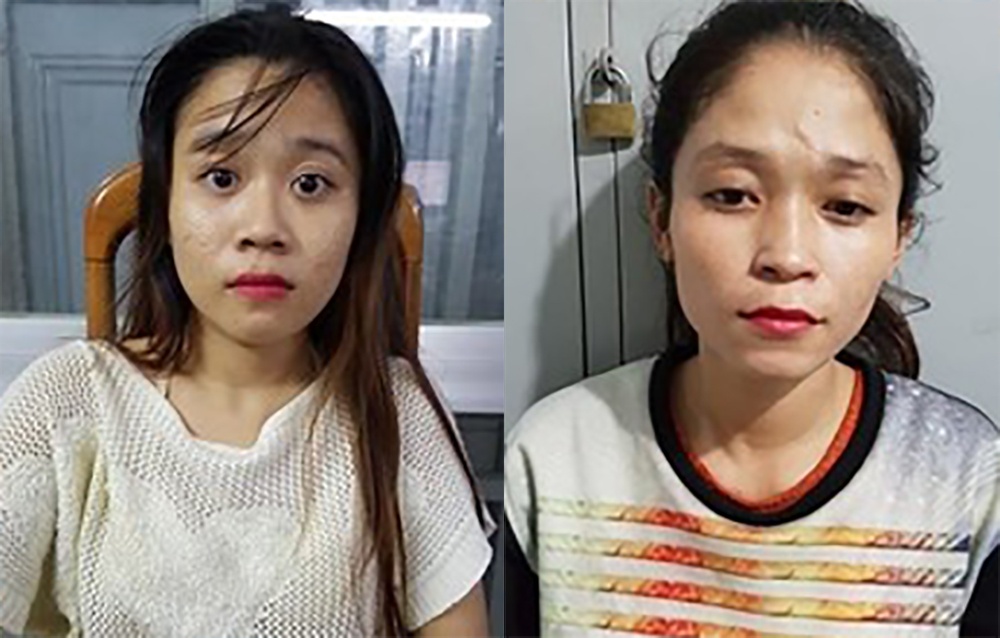 Hai co gai o Sai Gon tham gia moc trom iPhone cua nguoi di duong hinh anh