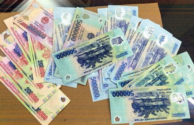 Quy dinh moi ve phat hien, thu giu tien gia, tam thu giu tien nghi gia hinh anh