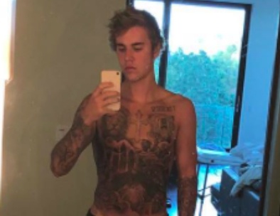 Justin Bieber chinh thuc xam kin nguoi hinh anh