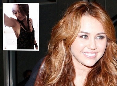 Miley Cyrus khoe hinh xam o vung nhay cam hinh anh