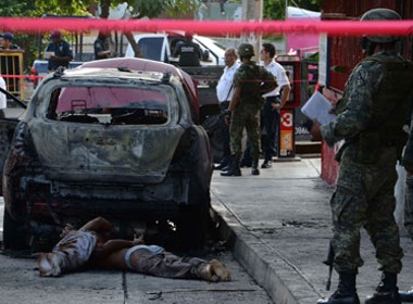 Phat hien them 32 thi the o Mexico hinh anh