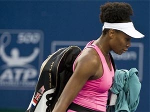 Venus Williams bi loai o Bac Kinh hinh anh