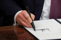 What executive orders did Trump sign on 'Day 1'?