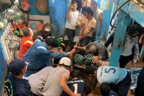 Nghet tho giai cuu 2 cha con roi xuong gieng sau 35 m o Gia Lai hinh anh