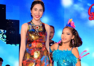 Thuy Tien mac mau me vao nhom trang phuc xau tuan qua hinh anh