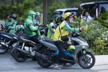 Cuoc dua dien hoa cua nha san xuat xe may va hang 'xe om' cong nghe hinh anh