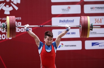 Trinh Van Vinh - nguoi mang y chi thep quyet san vang Olympic hinh anh