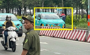 Taxi dien chay nguoc chieu gay tai nan chet nguoi o TP.HCM hinh anh