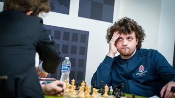 Doi thu qua kho voi vua co Carlsen hinh anh