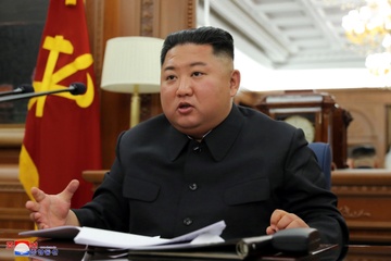 Ong Kim Jong Un chu tri hoi nghi quan uy trung uong mo rong hinh anh