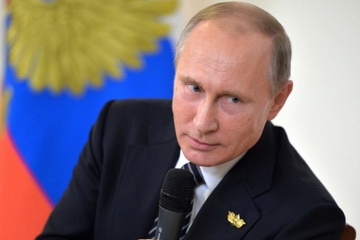 Dao dien ‘Snowden’ muon lam phim ve Tong thong Nga Putin hinh anh