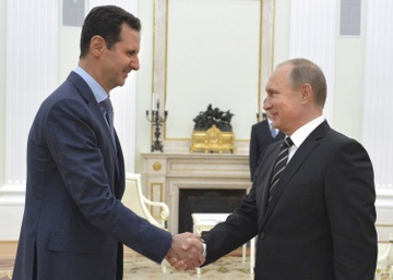 Nha Trang chi trich viec ong Putin tiep tong thong Syria hinh anh