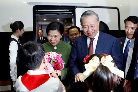 Tong Bi thu, Chu tich nuoc To Lam va Phu nhan tham thanh pho Nam Ninh hinh anh